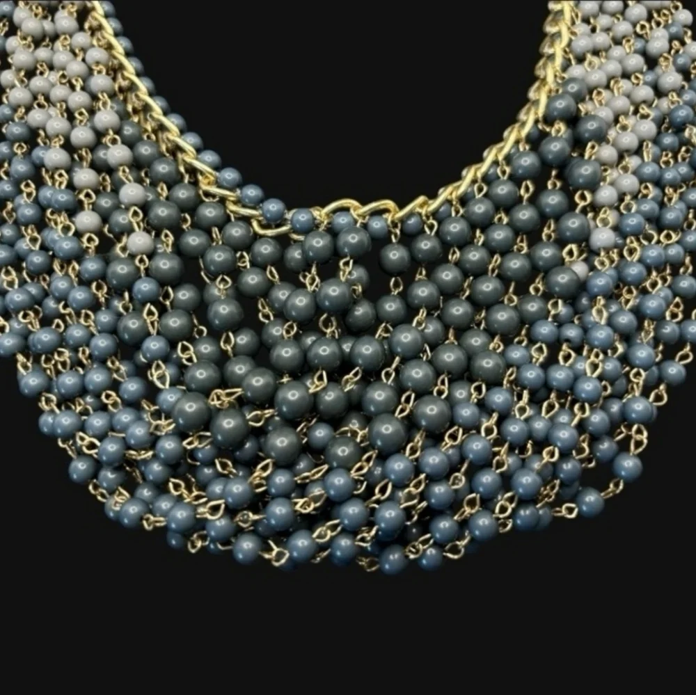 Gold plated cuban link chain with dangling graduated color jasper roundbeads